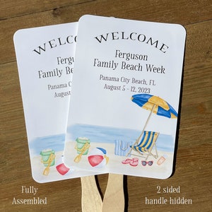 Puede incluir: Un abanico de bienvenida de dos caras con una escena de playa. La parte delantera dice "Welcome Ferguson Family Beach Week Panama City Beach, FL August 5-12, 2023". La parte trasera dice "Welcome Ferguson Family Beach".