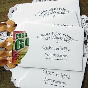 Our 50th wedding anniversary favors are personalized for the happy couple.  Printed on white cardstock with gold ribbon attached these will be a fun favor to give to guests.  Slide a lotto ticket in the open end and see who wins.