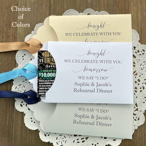 Wedding rehearsal dinner favors that are personalized for the bride and groom, slide a lotto ticket in to see who wins big.