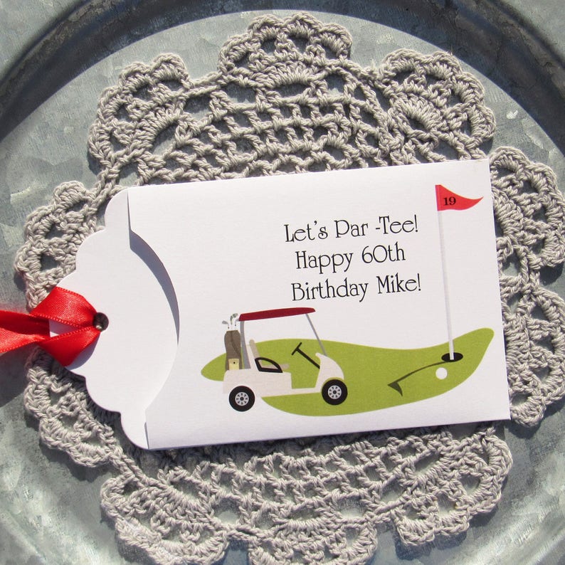 Golf birthday party favors, personalized for the guest of honor, printed on white card stock adorned with a red ribbon.  Let's Par Tee golf favors, slide a lotto ticket in for a fun birthday favor.