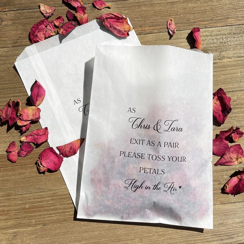 Wedding petal toss bags are personalized for the bride and goom.  As they exit as a pair please toss your petals high in the air.  Printed on glassine bags for a more elegant feel, larger than most petal bags they will hold plenty of flower petals.