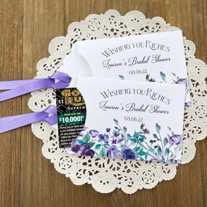 Wishing you riches bridal shower lotto ticket favors.  Favor envelopes are adorned with lavender flowers and ribbon which comes attached, personalized for the bride to be, these make fun bridal shower favors.