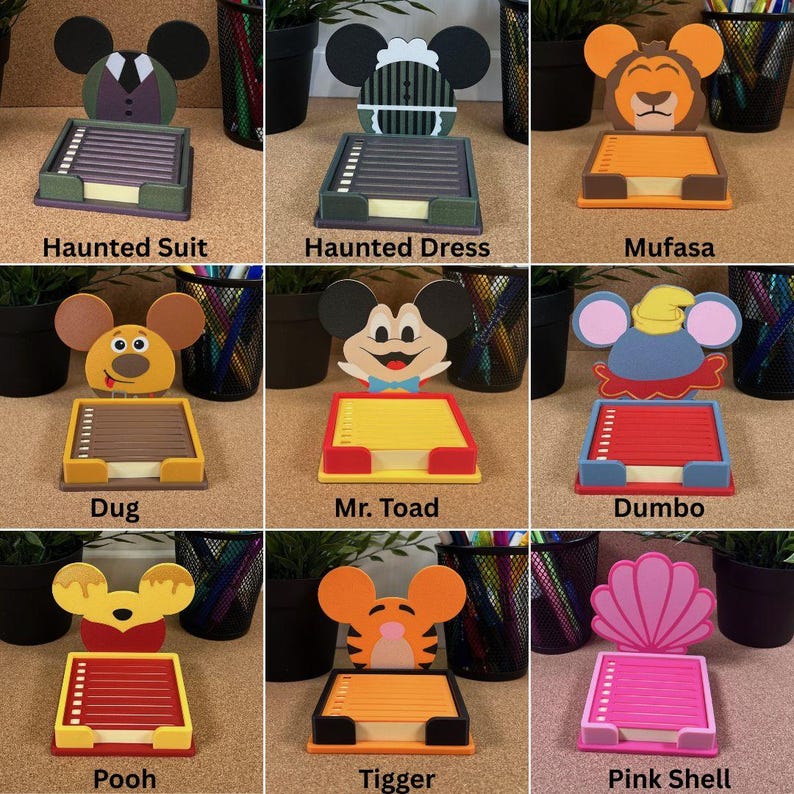 May include: A collection of nine character-themed sticky note holders, each featuring a unique cutout design including Haunted Suit, Haunted Dress, Mufasa, Dug, Mr. Toad, Dumbo, Pooh, Tigger, and a Pink Shell, with colourful paper pads.