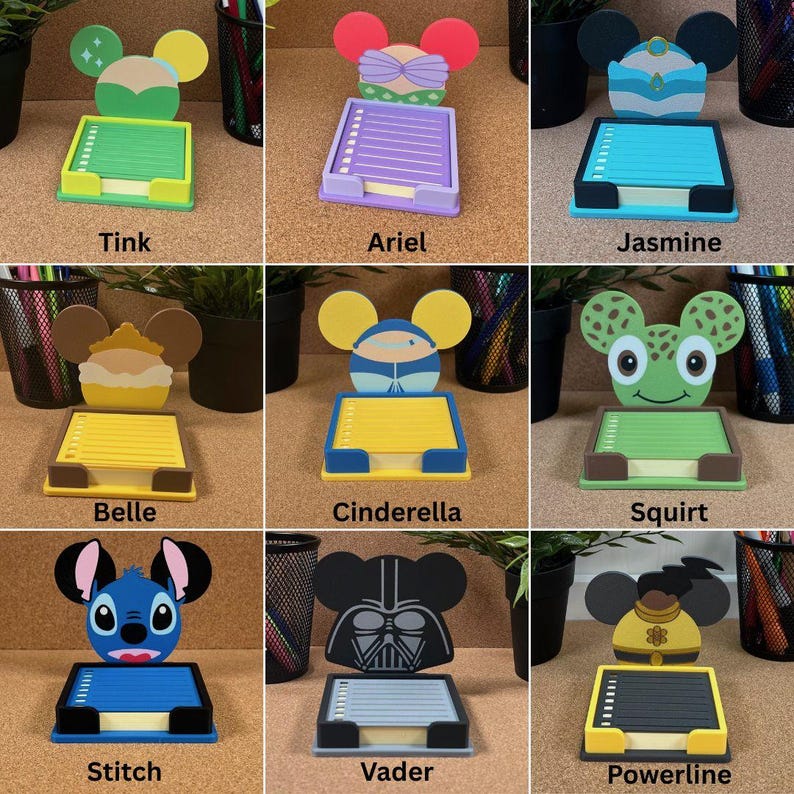 May include: A collection of nine character-themed sticky note holders, each featuring a unique design inspired by popular figures like Tink, Ariel, Jasmine, Belle, Cinderella, Squirt, Stitch, Vader, and Powerline, with colourful bases and paper pads.