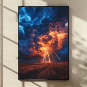 May include: A framed print depicting a dramatic thunderstorm. The image features a vibrant display of lightning bolts against a backdrop of fiery orange and deep blue storm clouds. A field of tall grass is in the foreground.