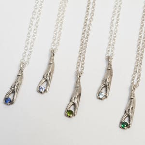 Sterling Silver Crab Claw Necklace, holding a tiny gemstone. Choose emerald, tanzanite, peridot, sapphire, or aquamarine.