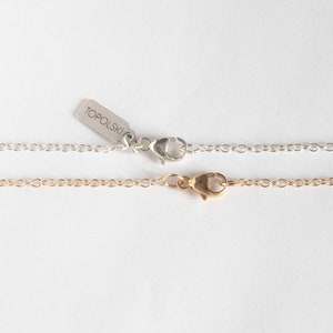 silver and gold-filled lobster clasps, on white background