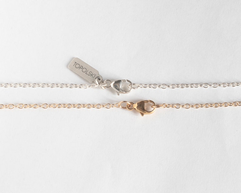 silver and gold-filled lobster clasps, on white background