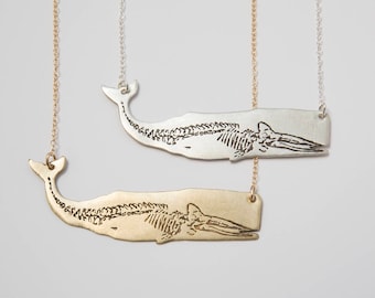 Silver or brass whale necklace, with etched skeleton