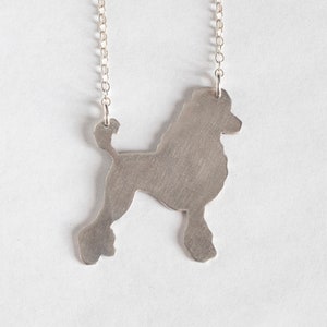 silver poodle silhouette necklace, shown on a white background