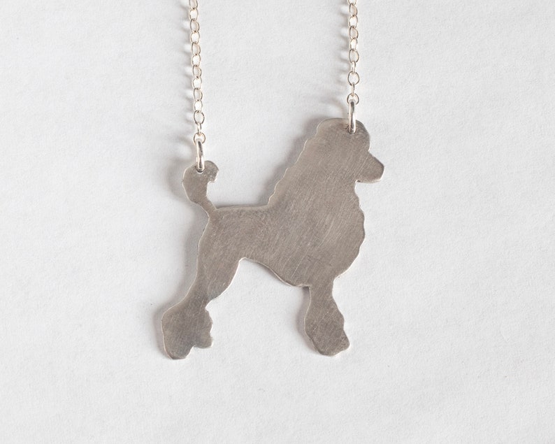 silver poodle silhouette necklace, shown on a white background