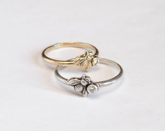 Tiny and delicate gold bee ring with small round gemstone