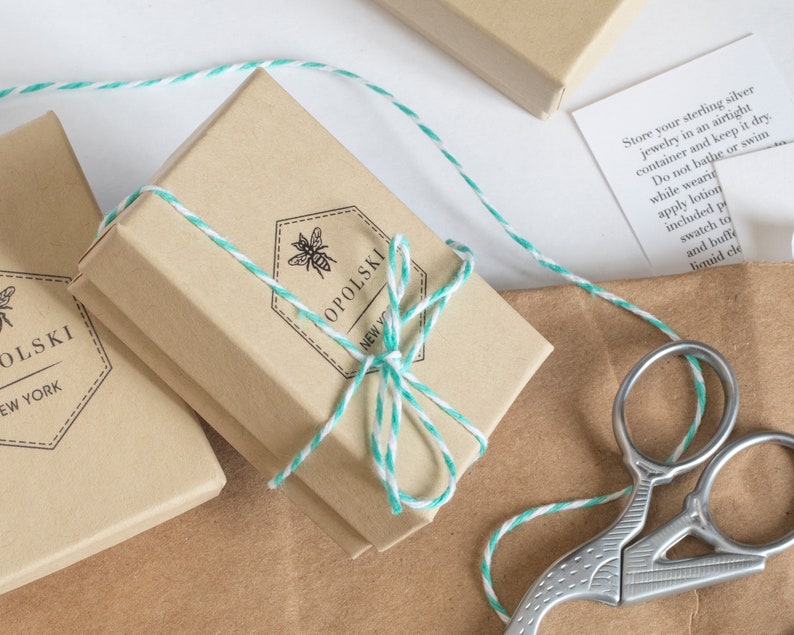 assorted jewelry packaging on a white background