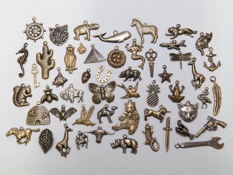 group of many available brass charms