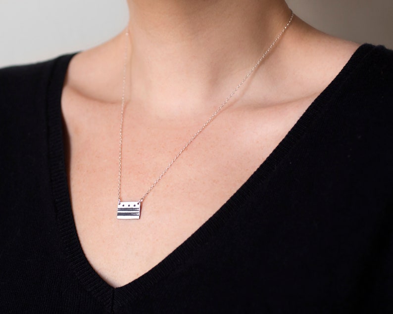 sterling silver washington DC flag necklace, on model's neck