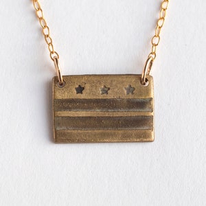 brass washington DC flag necklace, on white background