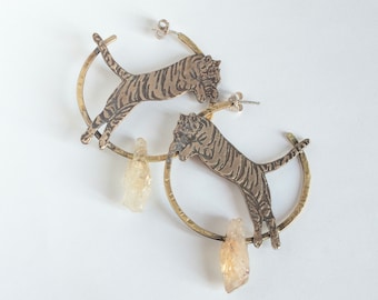 Etched Tiger Hoop Earrings in brass or silver, leaping over a crystal point