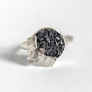 Tiny Hand-Carved Bat Ring, flying over a druzy quartz stone