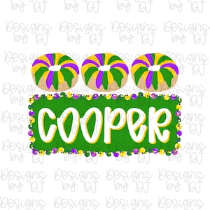 May include: A digital graphic featuring three king cakes with purple, green, and yellow icing. Below the cakes is a green rectangle with the name "COOPER" in white and yellow lettering, surrounded by purple and yellow beads.