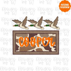 May include: A rectangular sign with the name "Cooper" in orange script, set against a brown and tan camouflage pattern. Above, three ducks in flight are depicted with brown, tan, and green details. The design includes the text "Original Designer".