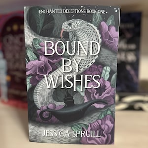 May include: A book cover with a purple and green floral design. A white snake with black spots is wrapped around a black genie lamp. The title of the book is "Bound by Wishes" and the author is "Jessica Spruill".