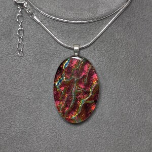 Large Dark Red Dichroic Fused Glass Oval Pendant on Black with a Silver-tone Chain