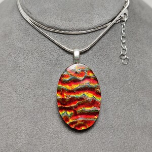 Fused Bright Red Dichroic Glass Large Oval Pendant on Black with a Silver-tone Chain