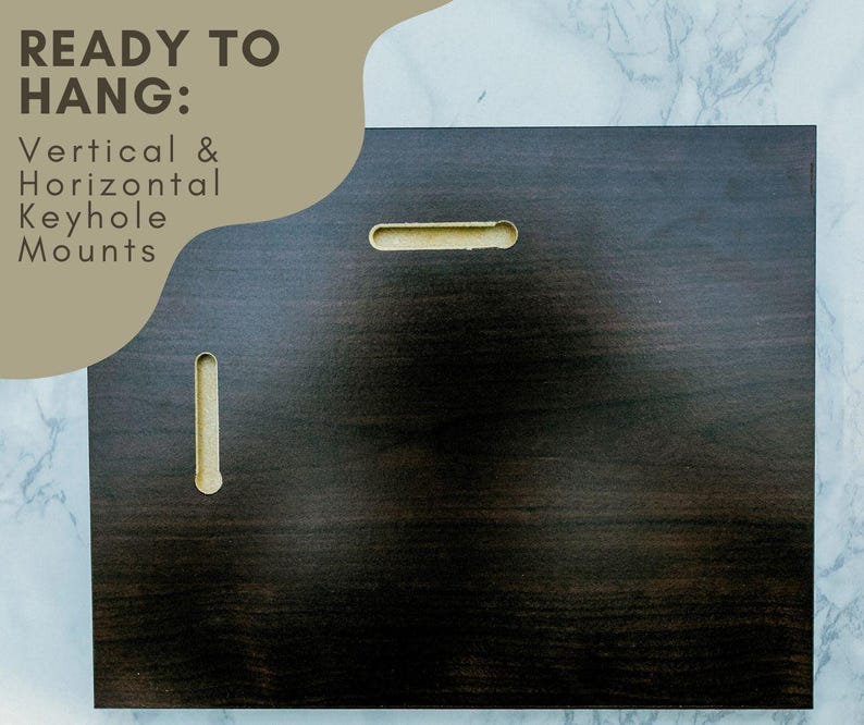 a dark wooden surface with a keyhole, accompanied by text that reads "READY TO HANG: Vertical & Horizontal Keyhole Mounts".