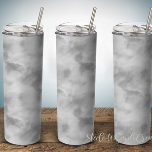 May include: Three stainless steel tumblers with lids and straws. The tumblers are white with a gray marble pattern.