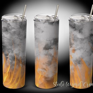 May include: Three stainless steel tumblers with a design of gray smoke and orange flames. The tumblers have lids and straws.
