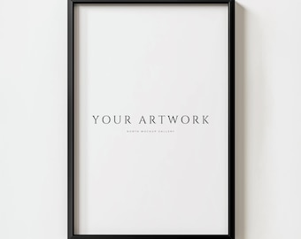 May include: A black picture frame with a white mat and the text "YOUR ARTWORK NORTH MOCKUP GALLERY" on a white wall.