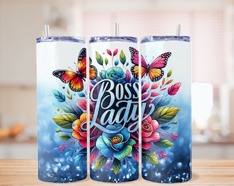 May include: Three stainless steel tumblers with a blue glitter background. The tumblers feature a colorful floral design with butterflies and the text "Boss Lady".