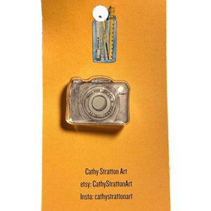 Camera pin