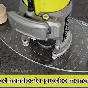 May include: A clear plastic router base plate with fitted wooden handles. The plate is designed for use with a Ryobi ONE+ P601 router and PCL424B. The text "Made in UK" and "CutPrint Engrave" are printed on the plate.