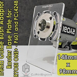 May include: A clear plastic router base plate for Ryobi ONE+ P601 and PCL424B routers. The plate is 148mm x 98mm and has a cutout for a router bit. The plate is shown with a Ryobi router.