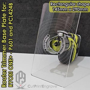 May include: A clear rectangular acrylic base plate for a Ryobi ONE+ router trimmer. The plate is 145mm x 290mm and has concentric circles etched into the surface. The plate is designed to be used with the Ryobi ONE+ P601 and PCL424B router trimmers.