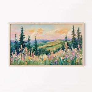 Puede incluir: Una pintura de un paisaje de montaña con un campo de flores silvestres en primer plano. El cielo es de un rosa y naranja suave, y las montañas son de un verde intenso. Las flores silvestres son de varios colores, incluyendo rosa, morado y amarillo.