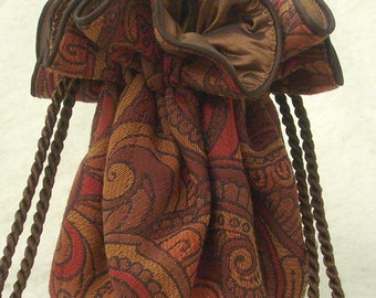 Jacquard swirls jewelry travel pouch in warm colors