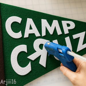 May include: A white ceramic mug with a black handle and the text "But First, Coffee" in a black, bold font. The mug is on a white surface.