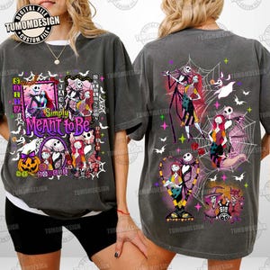 May include: A charcoal gray t-shirt featuring The Nightmare Before Christmas graphics. The front displays multiple framed scenes with Jack and Sally and the text Simply Meant to Be. The back shows various character illustrations and spiderwebs.