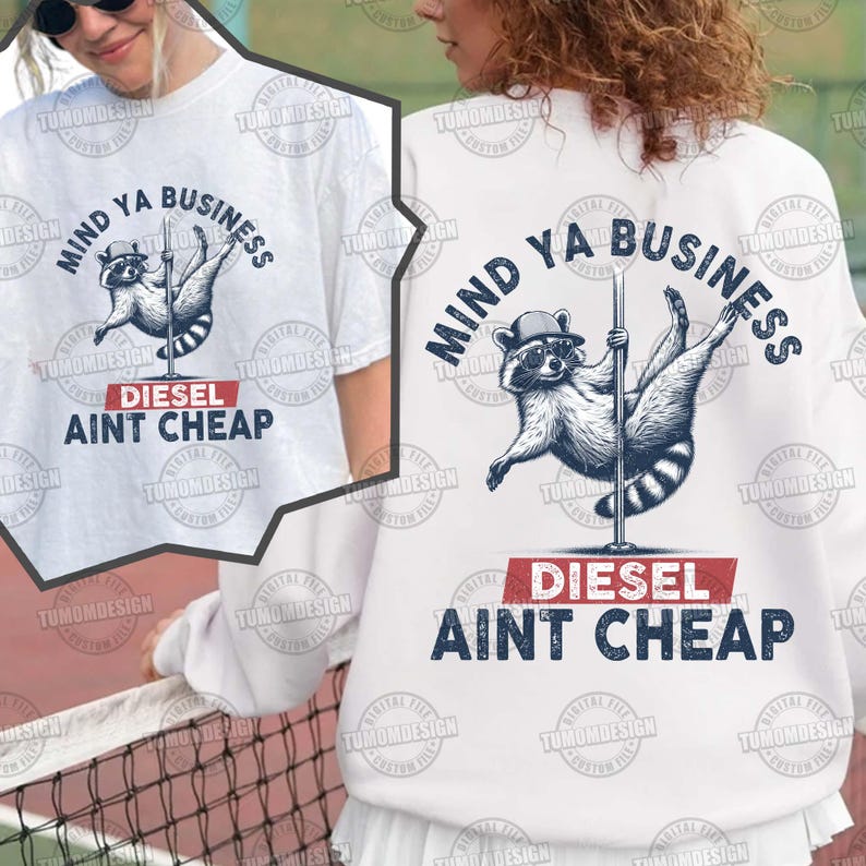 May include: White t-shirt with a raccoon wearing sunglasses and holding a pole dancing. The text on the shirt reads "Mind Ya Business Diesel Ain't Cheap".