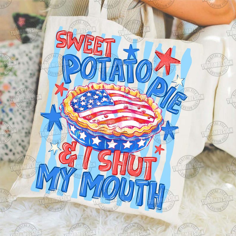 May include: A cream-colored tote bag with a patriotic design. The bag features the text "SWEET POTATO PIE & I SHUT MY MOUTH" in red and blue, along with a pie decorated with the American flag and stars.