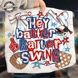 May include: A baseball-themed design with the words "Hey Batter Batter Swing" in red and blue. The design includes a baseball bat, helmet, glove, bow, stars, and a foam finger. The overall theme is sports.