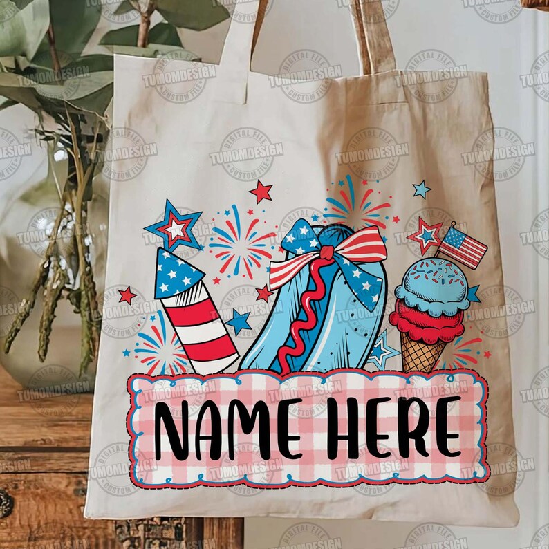 May include: A beige tote bag featuring a patriotic design with a red, white, and blue color scheme. The design includes a firework, a hot dog, an ice cream cone, stars, and the text "NAME HERE" in a checkered frame. The bag has two handles.