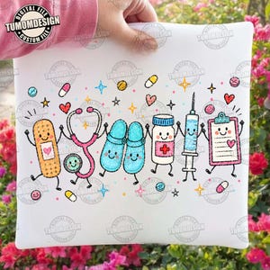May include: A white graphic print featuring a row of anthropomorphic medical items including a bandage, a pink stethoscope, blue clogs, a medicine bottle, a syringe, and a clipboard, all decorated with small hearts, stars, and colorful pills.