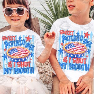 May include: Two children wearing white t-shirts with a patriotic design. The shirts feature the text "Sweet Potato Pie & I Shut My Mouth" above an illustration of a pie decorated with the American flag. The background has blue stripes and stars.
