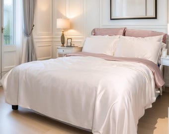 El juego de cama de seda morera de 4 piezas incluye: funda nórdica, sábana ajustable, 2 fundas de almohada de 25 momme