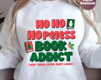 May include: White sweatshirt with a red and green Christmas-themed graphic that says "Ho Ho Hopeless Book Addict (Dear Santa, bring more books)".