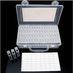 May include: A clear plastic storage box with a handle and a clear lid. The box has 100 small compartments for storing beads, rhinestones, or other small items. The box comes with a sheet of labels for organizing the compartments.