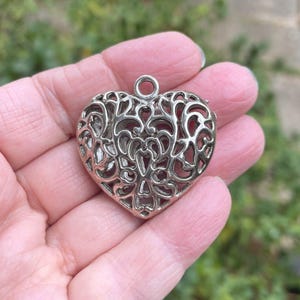 Filigree Heart pendants. Silver, Hollow, antiqued. Reversible. Set of 2.